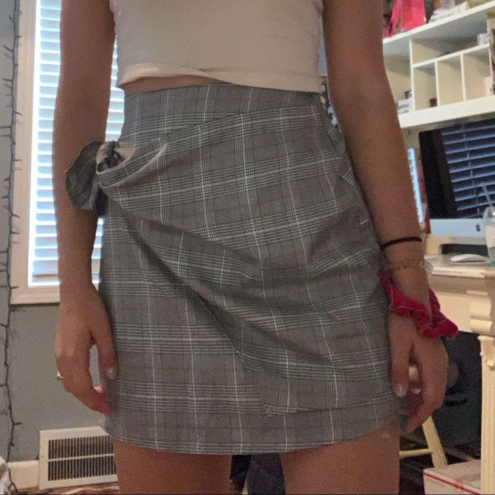 Plaid wrapped skirt pinned to fit right